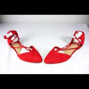 Red tie around the ankle flats